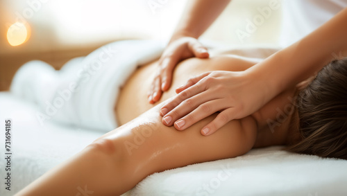 A beautiful woman enjoying a relaxing back massage during a delightful spa weekend