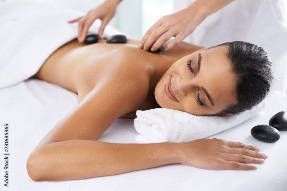 Relax, calm and woman with hot stone massage at spa for health, wellness and back treatment. Self care, sleeping and female person with warm rock skin therapy with masseuse at natural beauty salon. Relax, calm and woman with hot stone massage at spa for health, wellness and back treatment. Self care, sleeping and female person with warm rock skin therapy with masseuse at natural beauty salon.
