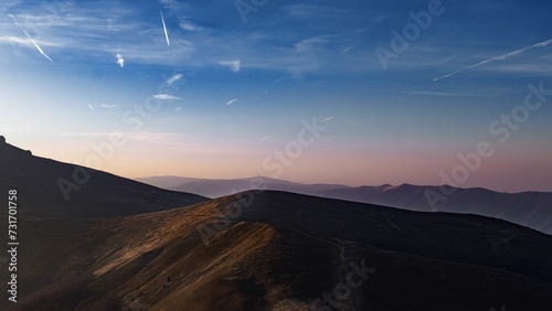 Majestic pastel sunset over the mountain range photo