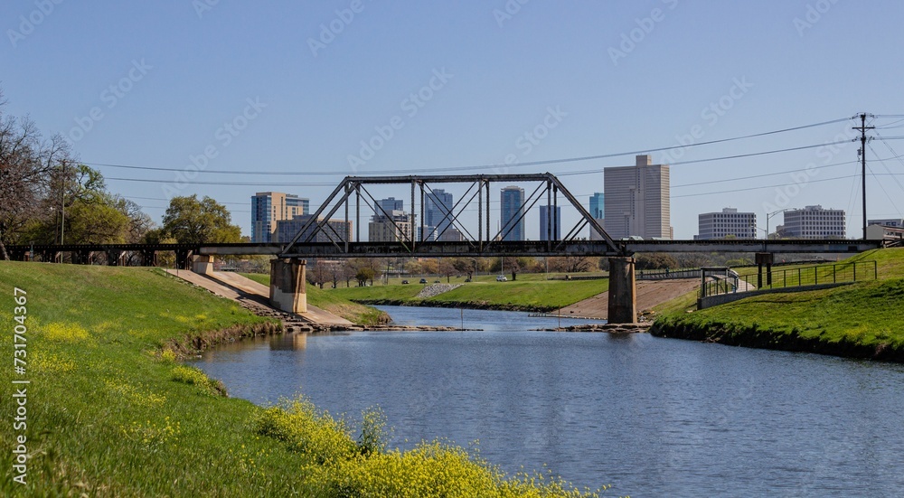 there is an old railway bridge that crosses a creek between the city and park there is an old railway bridge that crosses a creek between the city and park
