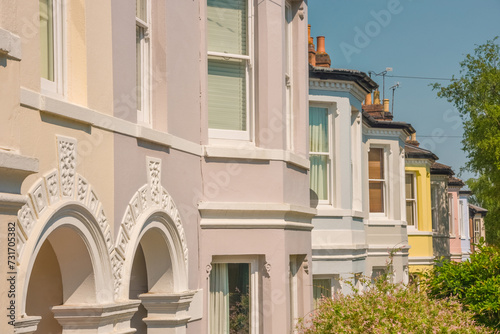 Nice Neighbourhood. Colorful pastel terraced houses in a row in classic architectural English style.