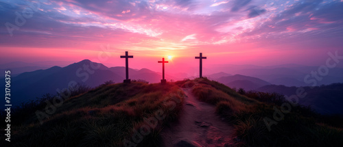 Crucifixion and Resurrection of Jesus at sunset. Three wooden crosses against beautiful sunset in the mountains. Catholicism symbols. Easter concept.