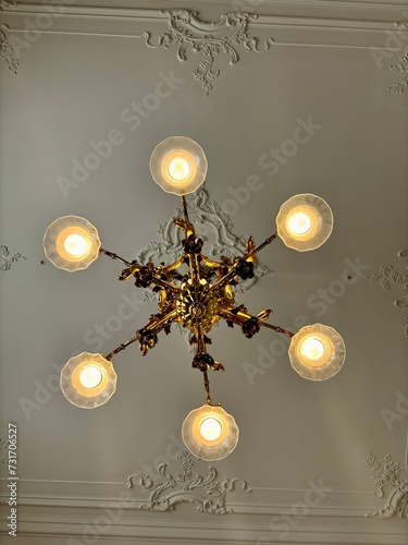 golden chandelier on white ceiling renaissance