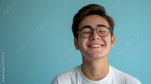 A young man wearing glasses in front of a sky blue background is smiling awkwardly. current situation is unfortunate, but the concept of hope that it will go well in the future. generative AI