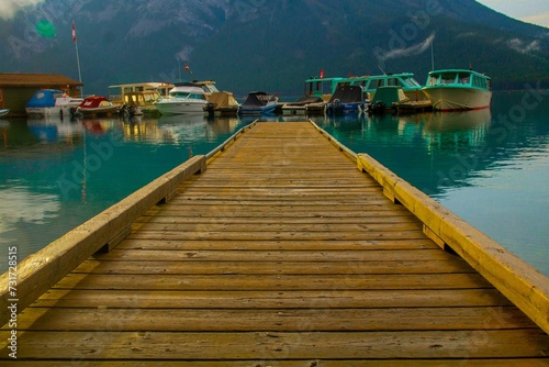 there is a wooden dock at the end of the water