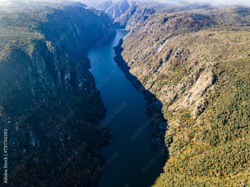Fototapeta premium view of the Douro river between the mountains and hills at sunset, Portugal