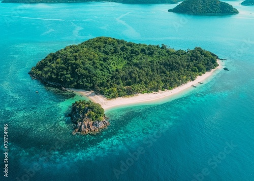 Aerial view of a tropical island surrounded by crystal blue waters and pristine white sandy beaches