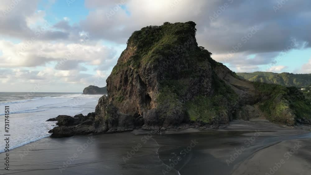 Aerial video of the rocky mountains and sea waves, Piha beach, North Island, New Zealand Aerial video of the rocky mountains and sea waves, Piha beach, North Island, New Zealand