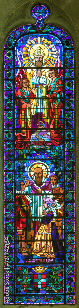 ANNECY, FRANCE - JULY 11, 2022: The modern stained glass with the St. Francis of Sales in St. Pierre Cathedral from 20. cent. 