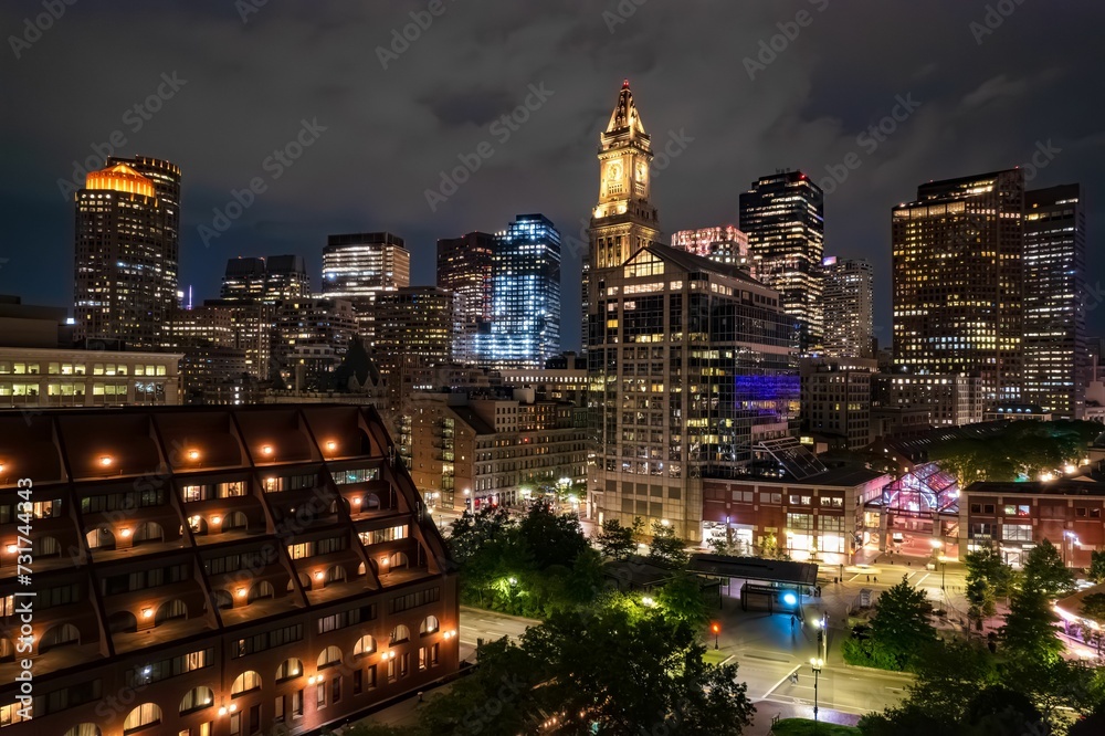 Custom House Tower's clock lights up the Boston skyline at night