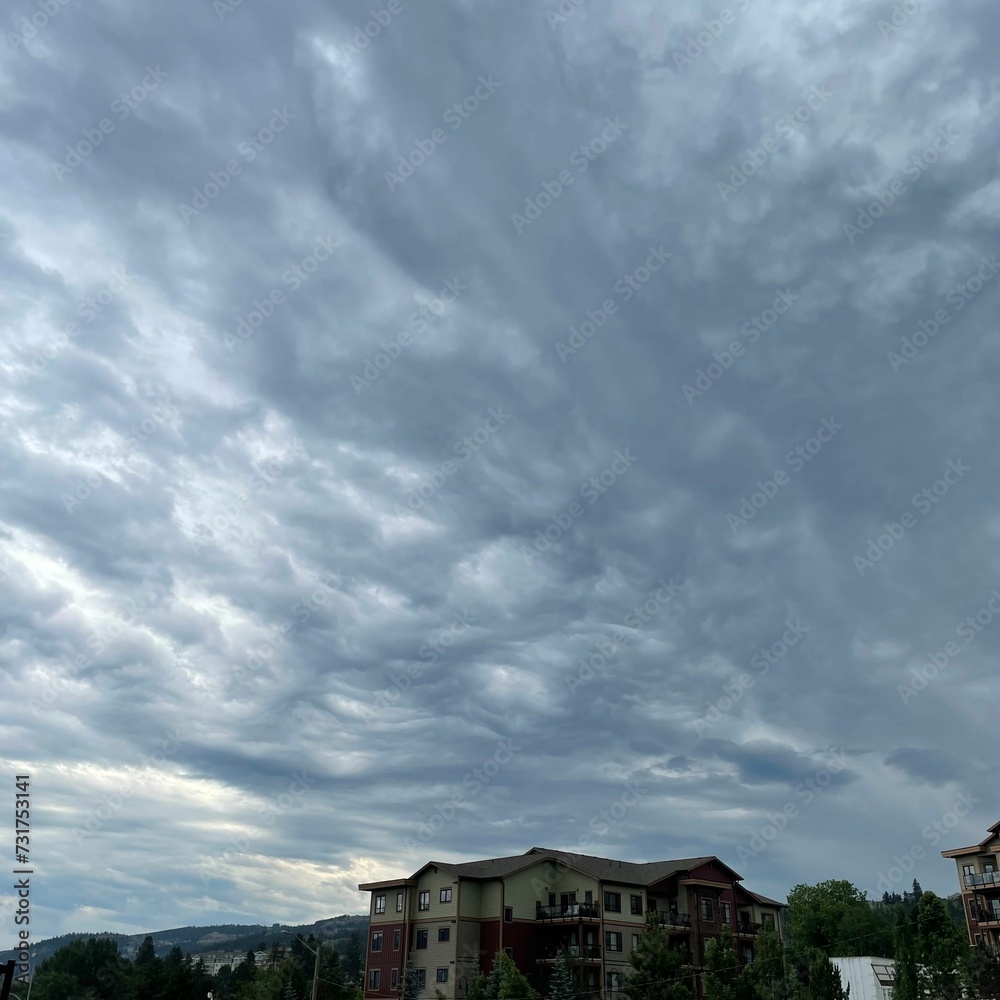 Beautiful view of a cloudy sky over an urban residential area