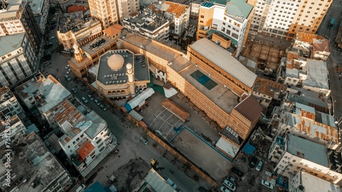 Aerial view of a bustling metropolitan skyline, showcasing the tall buildings of an urban city