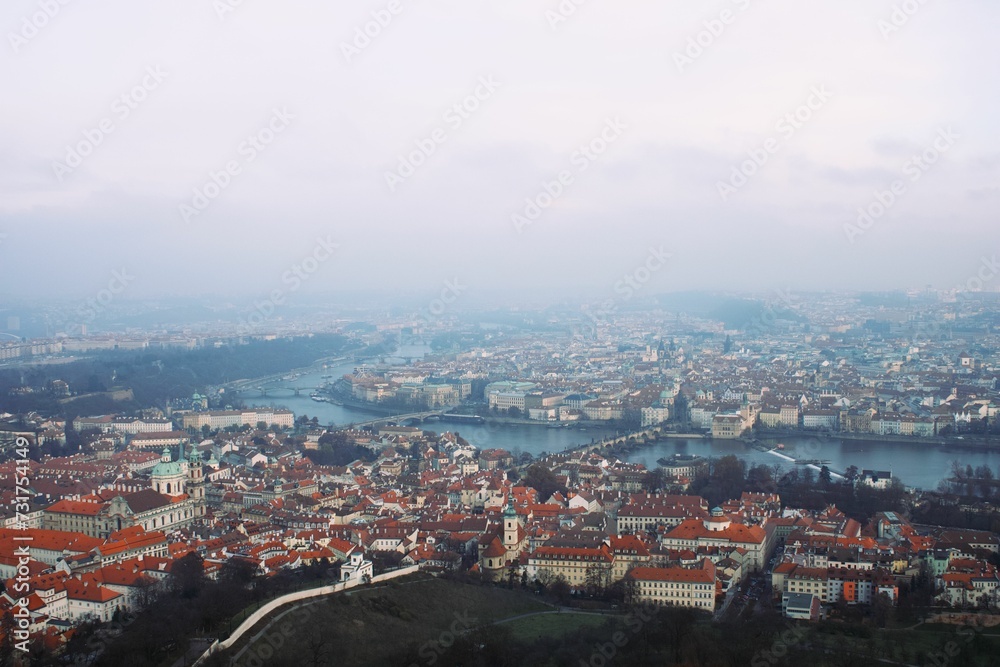 Cityscape of Prague covered in the fog on a gloomy day in the Czech Republic