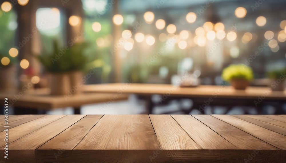Empty wooden table in front of blurred bokeh background of restaurant. Mock up for display products