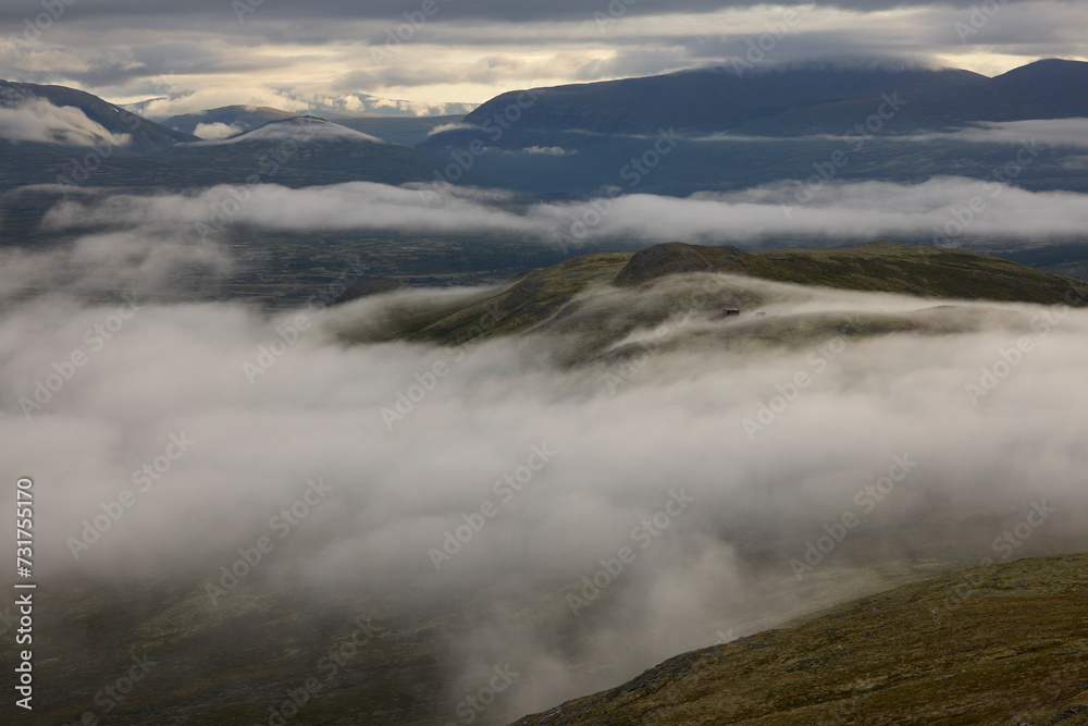 Tranquil scene of dramatic cloudy sky amidst mountain Tranquil scene of dramatic cloudy sky amidst mountain