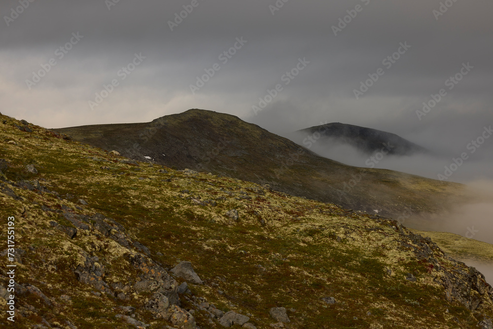 Beautiful view of mountains against cloudy sky