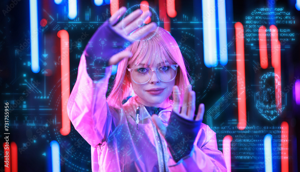 Hologram woman in futuristic costume with flowing hair. Female in modern VR glasses interacting with network while having virtual reality experience. Augmented reality game, future technology, AI. Hologram woman in futuristic costume with flowing hair. Female in modern VR glasses interacting with network while having virtual reality experience. Augmented reality game, future technology, AI.