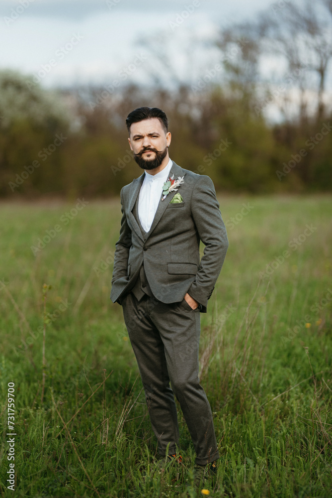 portrait of a young bearded guy groom portrait of a young bearded guy groom