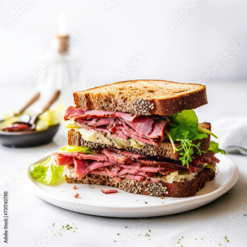 Homemade Pastrami sandwich on the plate on white kitchen