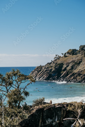 The headland at Cabarita with surfers out. photo