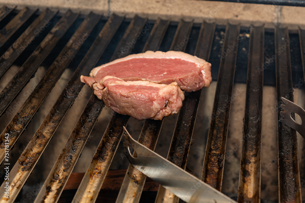 grilling picanha steak on the grill, brazilian barbecue