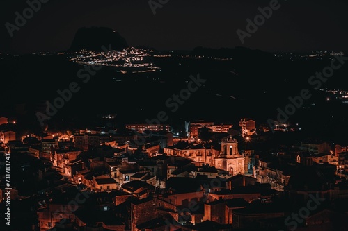 Fototapeta Naklejka Na Ścianę i Meble -  Aerial view of illuminated buildings in city at night, Casteltermini