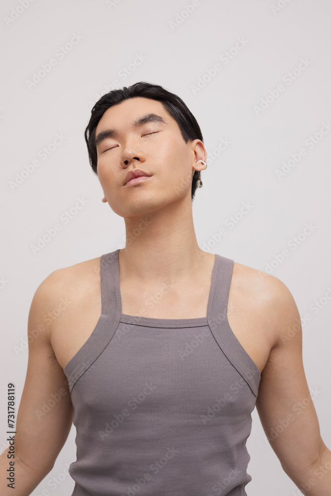 Studio portrait of handsome man with ear piercing Studio portrait of handsome man with ear piercing