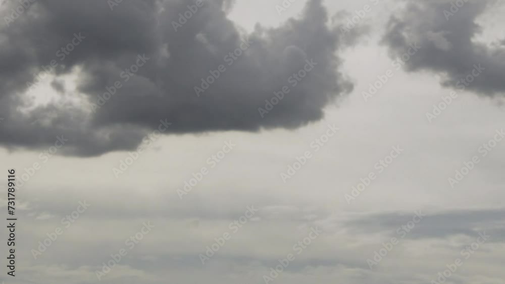 Dark Cumulus Clouds in Sunlight Float in Rainy Sky Slow Motion, Time Lapse. Stormy Gray Sky with Puffy Black Gray Clouds in the Rays of the Sun. Bad Weather. Beauty, Meteorology, Background, Relax. Dark Cumulus Clouds in Sunlight Float in Rainy Sky Slow Motion, Time Lapse. Stormy Gray Sky with Puffy Black Gray Clouds in the Rays of the Sun. Bad Weather. Beauty, Meteorology, Background, Relax.