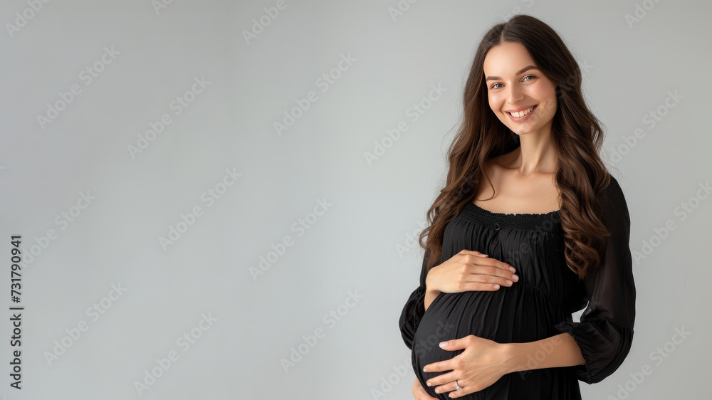 Caucasian pregnant woman with pregnancy belly, in soft black clothes Caucasian pregnant woman with pregnancy belly, in soft black clothes
