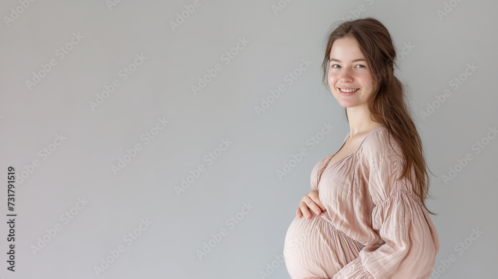 Caucasian pregnant woman with pregnancy belly, in soft pink clothes Caucasian pregnant woman with pregnancy belly, in soft pink clothes