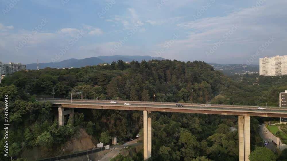 Drone shot over a Santa Fe bridge with a view of West borough in Mexico City Drone shot over a Santa Fe bridge with a view of West borough in Mexico City