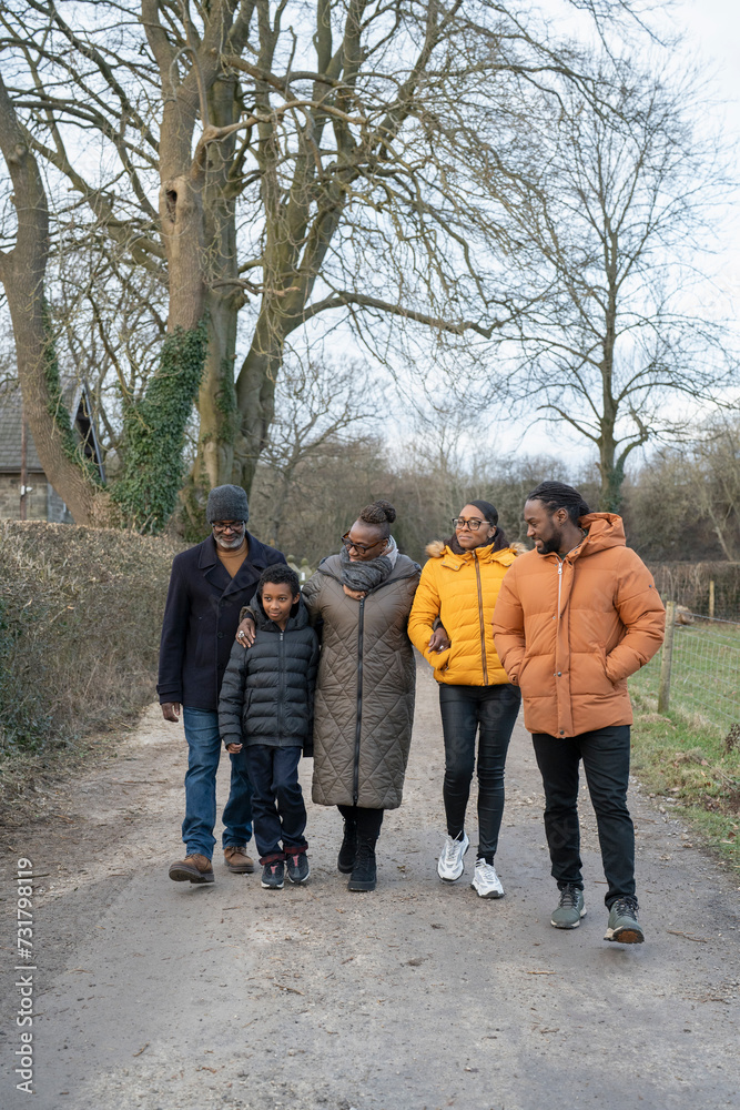 Three generation family walking together in rural area Three generation family walking together in rural area