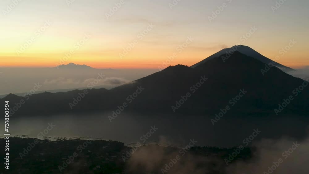 Aerial video of a lake and Mount Batur during sunset, Batung, Bali, Indonesia Aerial video of a lake and Mount Batur during sunset, Batung, Bali, Indonesia