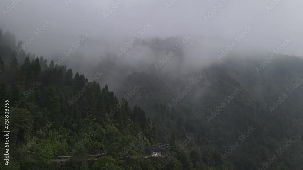 Drone view of forested landscapes during foggy weather Drone view of forested landscapes during foggy weather