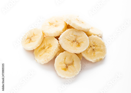 Fresh raw organic banana slices on white background.