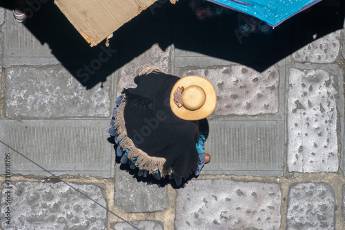 Distant view of anonymous indegenous people dressed in their traditional dresses in central La Paz, Bolivia photo