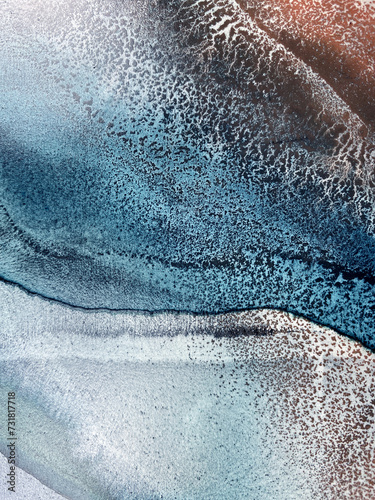 Abstract fluid art in green and turquoise tones. Hand-made with alcohol ink. Features organic flowing shapes. No real property or natural materials depicted.