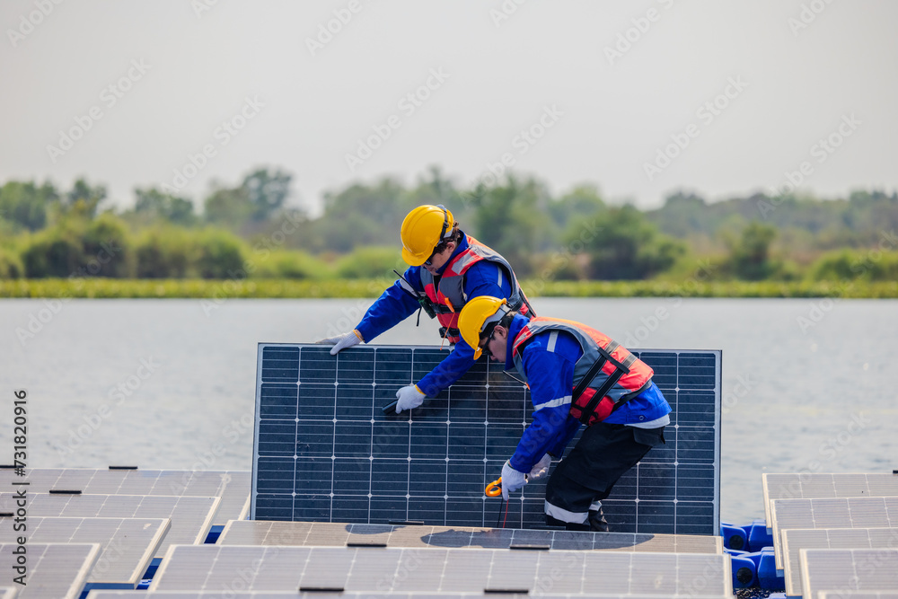 Technicians check floating solar farm wiring, polarity, and grounding for reliability and safety Technicians check floating solar farm wiring, polarity, and grounding for reliability and safety