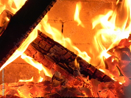 Fire close-up in the fireplace, coziness in the house, warmth, natural heater