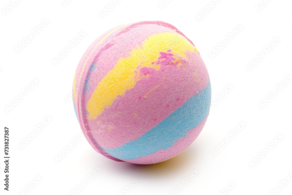 A single colorful bath bomb isolated on a white background
