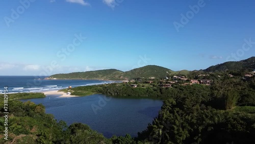 Wallpaper Mural Drone view over the Praia do Rosa beach surrounded by green vegetation Torontodigital.ca