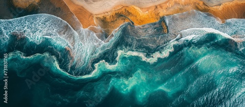 Oceanic layers of colors created by concentric river runoff seen from above.
