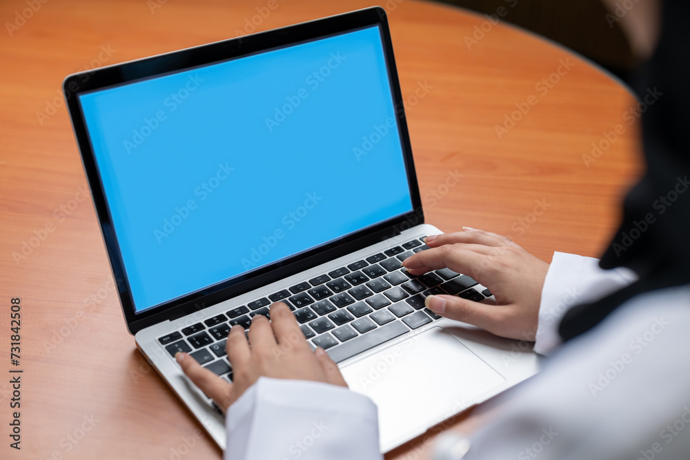 Hands typing on a laptop Hands typing on a laptop