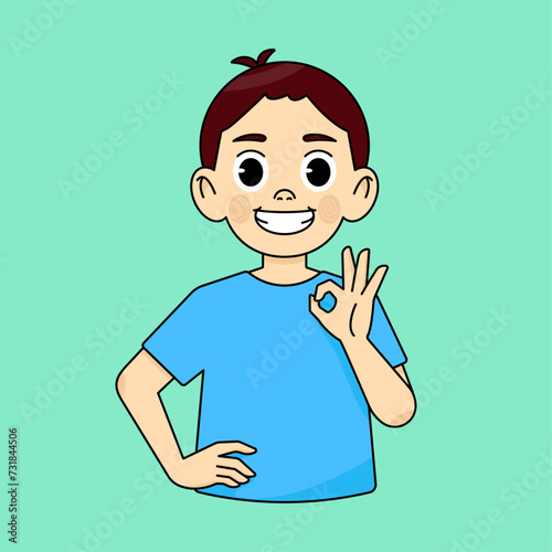 The boy smiles and shows an approving OK gesture and recommends something good