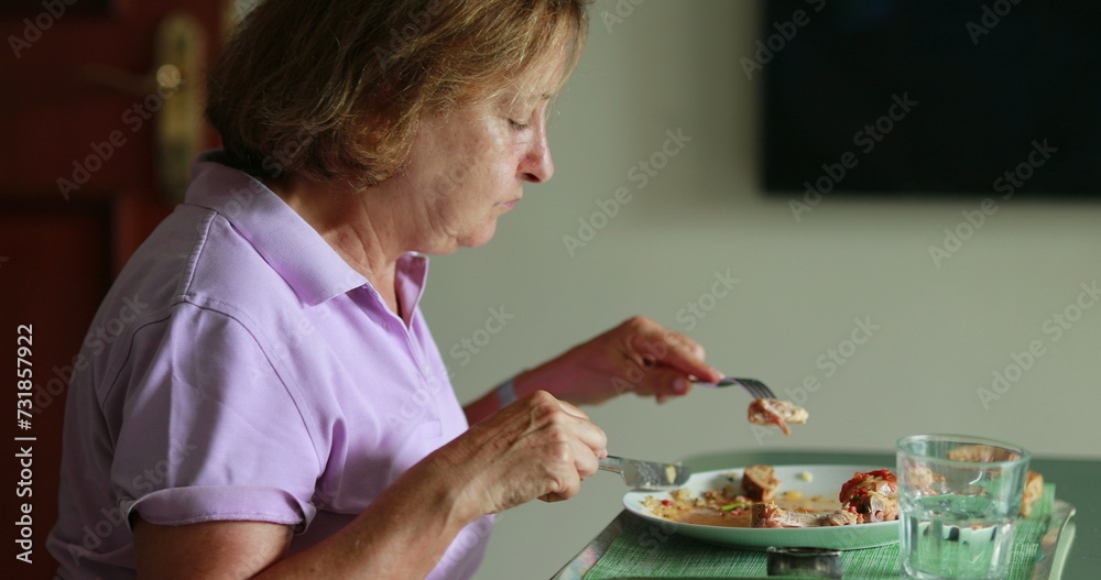 Older woman eating lunch candid authentic