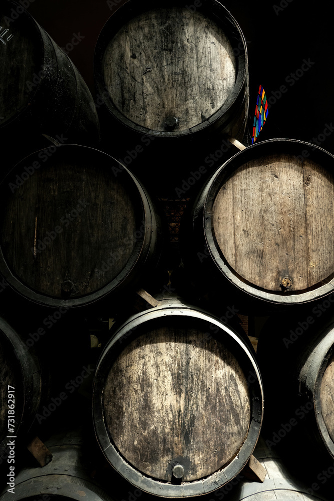 Wine casks at the winery. Stacked Wine barrels at the german winery. Old vintage whisky cask. old Single Malt Wine casks at the winery. Stacked Wine barrels at the german winery. Old vintage whisky cask. old Single Malt