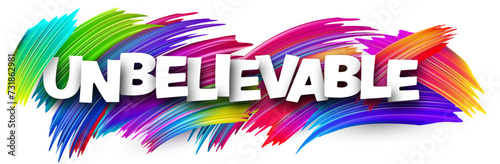 Unbelievable paper word sign with colorful spectrum paint brush strokes over white.