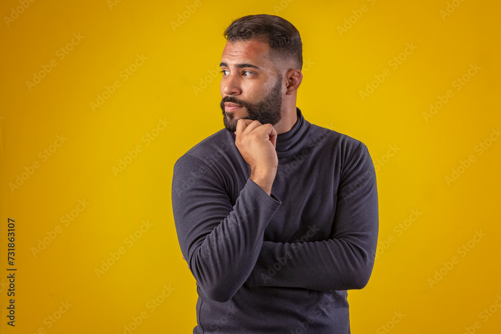 Fototapeta premium Man with beard wearing black shirt, with various facial expressions