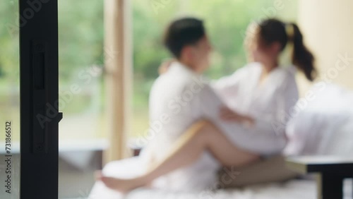 Blurred asia people young adult body on hotel cozy sofa bed outdoor home in health care safe sex flirt relax hug kiss. I love you man woman falling in love tender sexual pose happy asian just married. photo