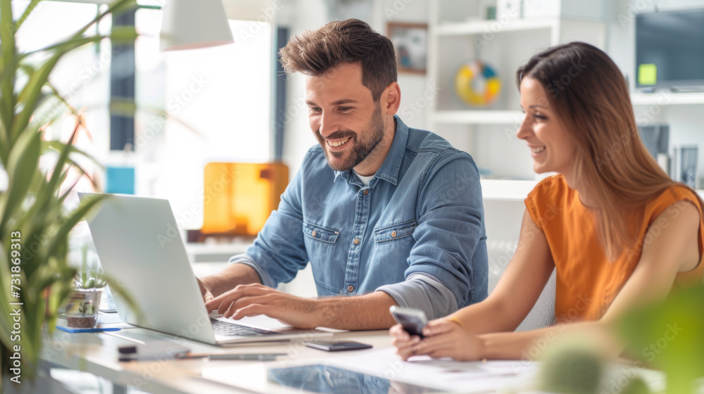 professional man and woman discussing work while looking at a laptop screen together in an office setting professional man and woman discussing work while looking at a laptop screen together in an office setting